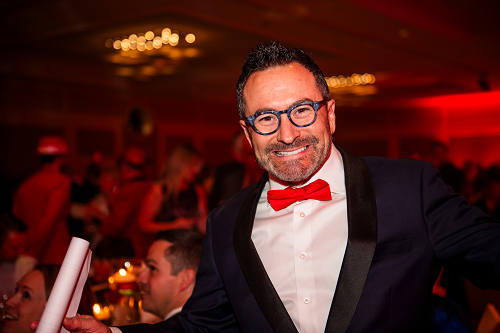 Smiling man in red bowtie.